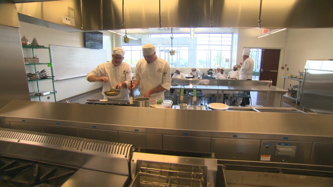 Two student chefs working in the JCCC Culinary Institute