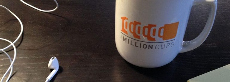 1 Million Cups logo with mug and heaphones