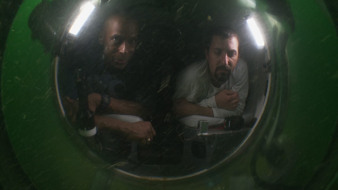 Image of Dr. Lewis and another man in a submarine.