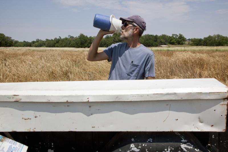 A man in Kansas takes a drink from a water container. While about 96 percent of Kansans receive water from public water supplies that meet or exceed all state and federal regulations for clean water, some public water systems have one of more sources that exceed safe levels of contaminants.