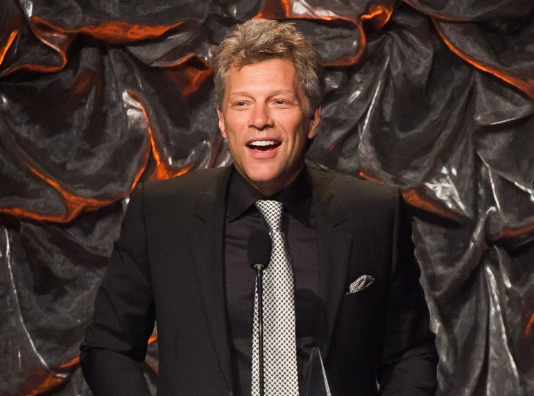 In this file photo, Jon Bon Jovi attends the Songwriters Hall of Fame Awards in New York. Bon Jovi has joined forces with Paul McCartney, Sheryl Crow, Fergie and others to record 