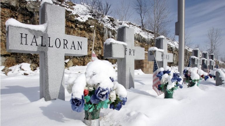 Graves of firefighters covered in snow