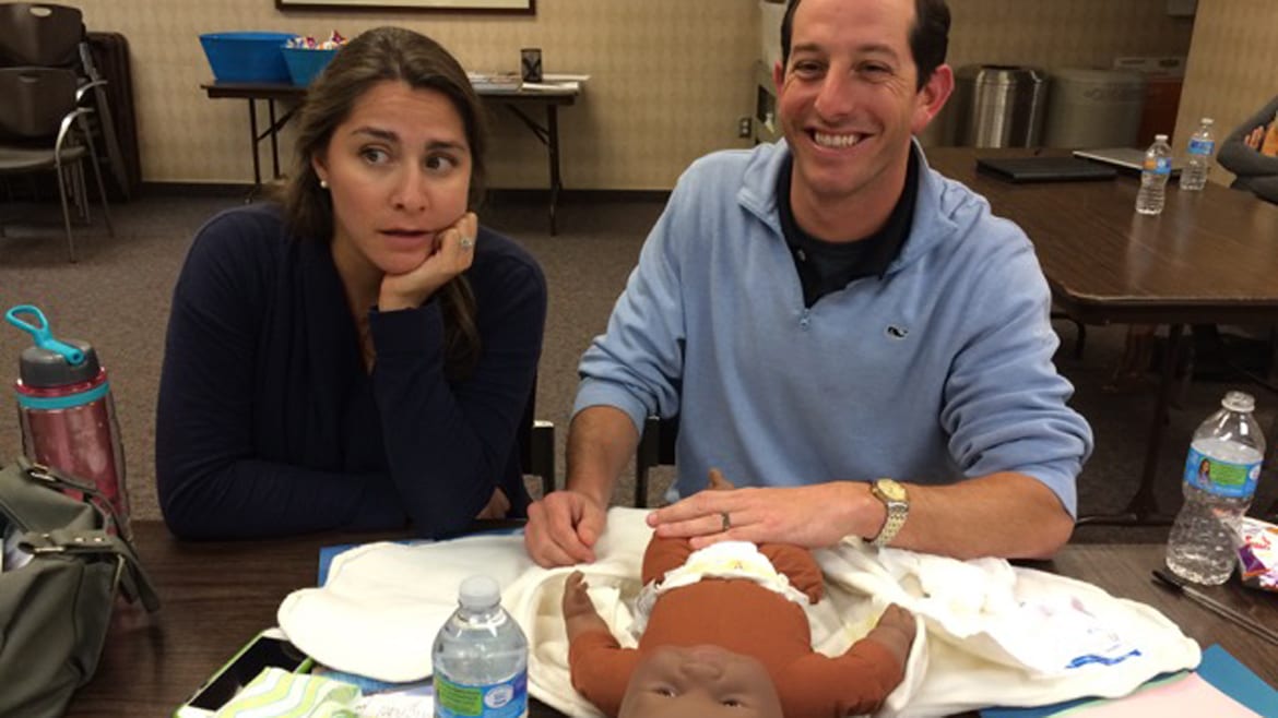 First-time expectant parents Melissa and Michael Funaro find the lessons of parenthood somewhat daunting at an infant care class at Shawnee Mission Medical Center in Merriam, Kansas. (Photo: Alex Smith | Heartland Health Monitor)