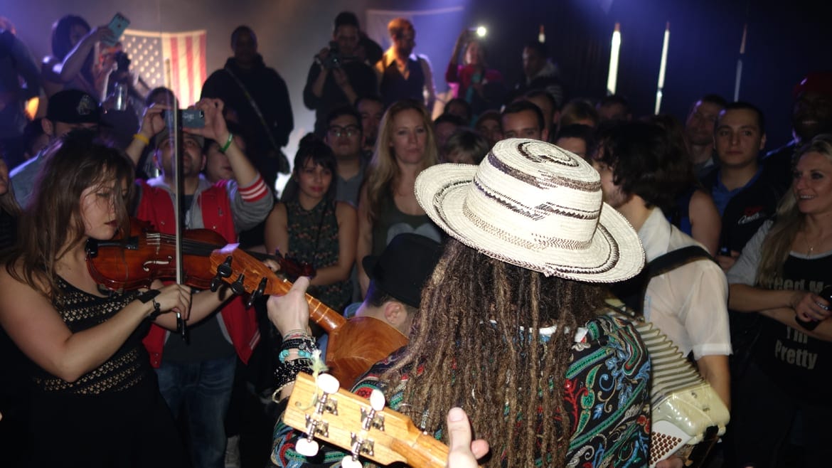 Crowd surrounds musicians