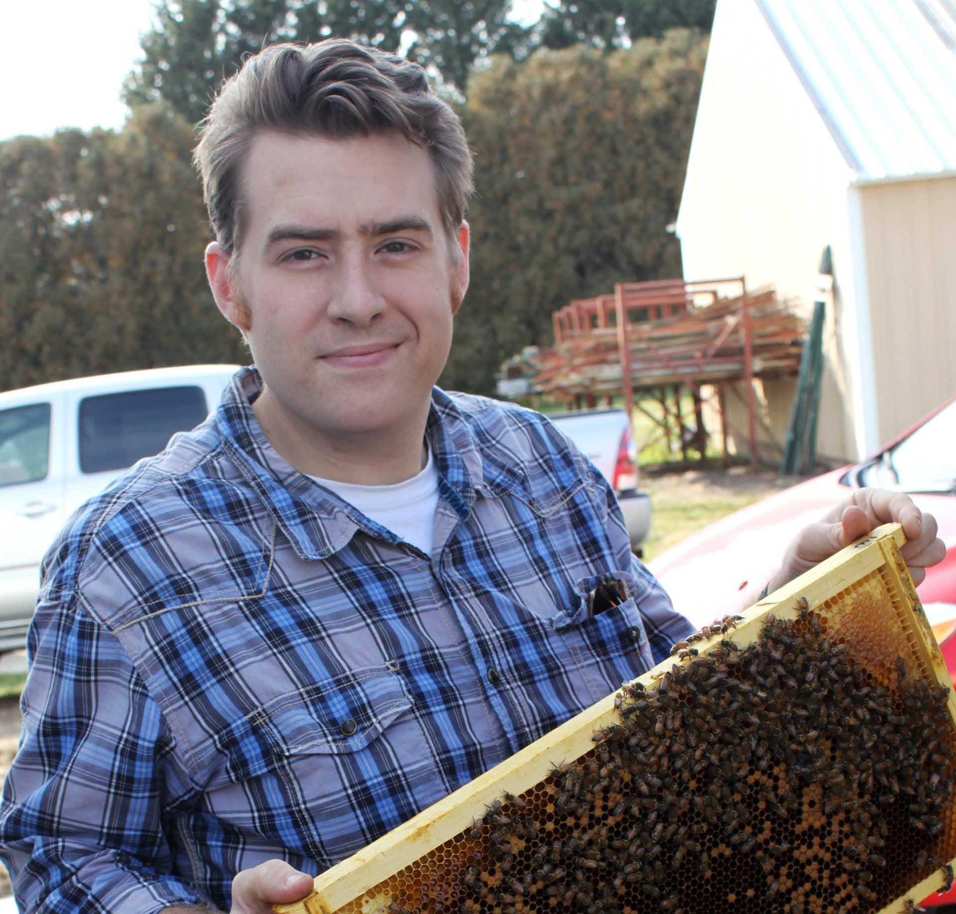 Iowa State University's Adam Dolezal says new research shows that people have contributed to honeybee disease spread. (Photo: Courtesy Adam Dolezal)