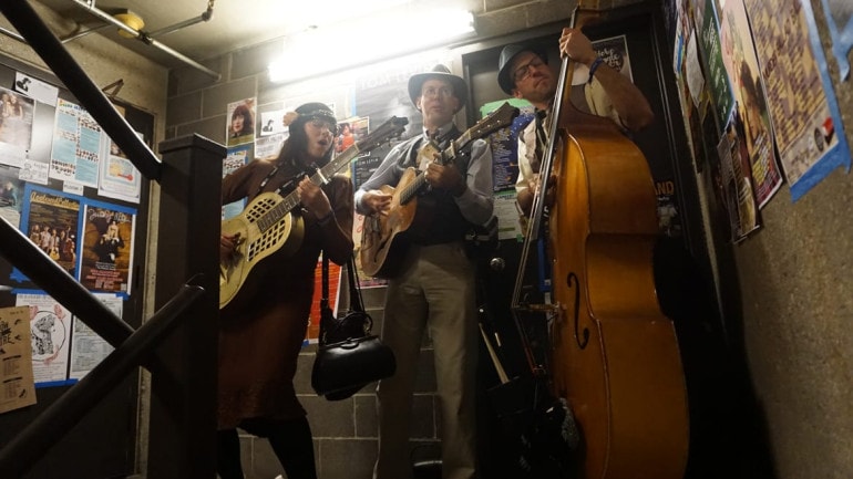 The music life is about making things work. Here, musicians warm up in a stairwell during the opening night of Folk Alliance International at the Westin Crown Center. (Photo: Sarah Bradshaw | The Bridge)