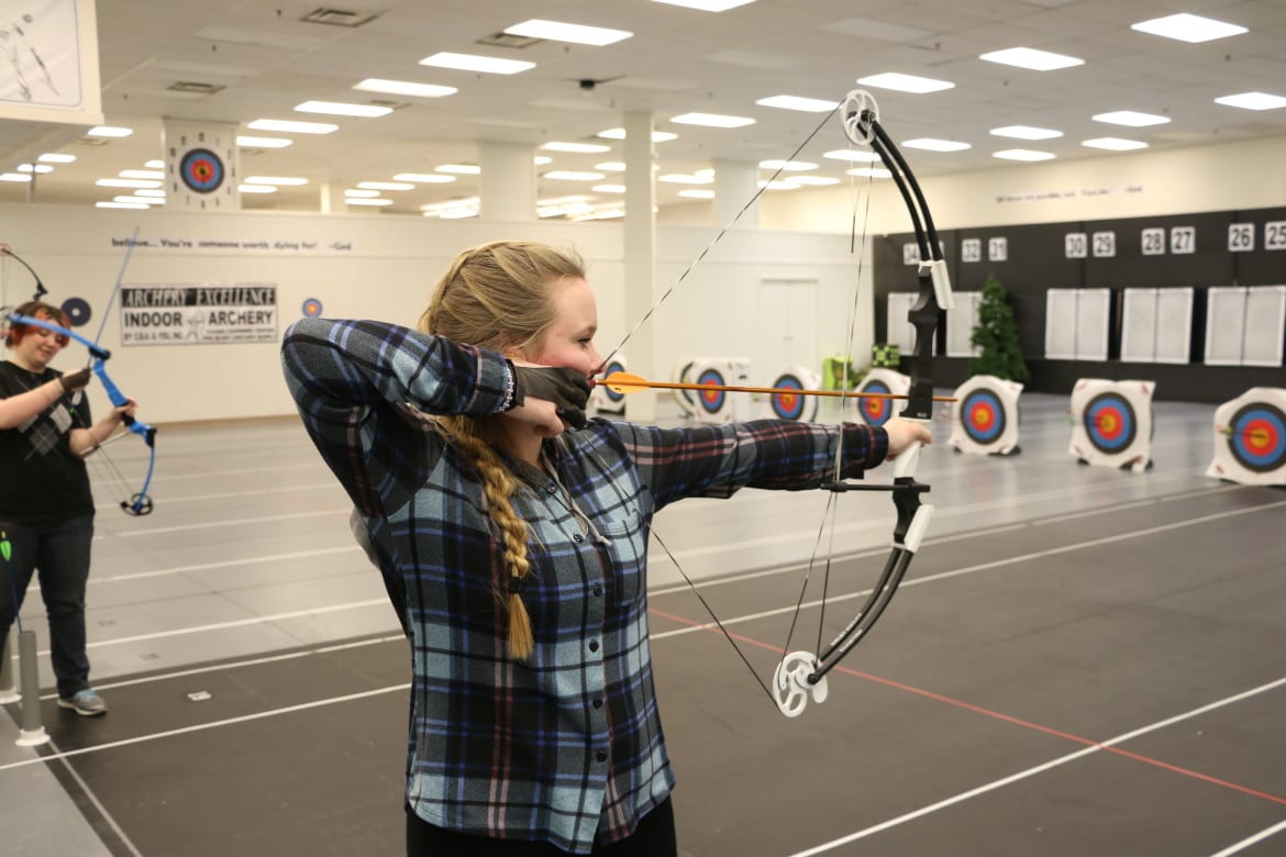 Three-time Missouri State Champion Shelby Winslow practicing archery