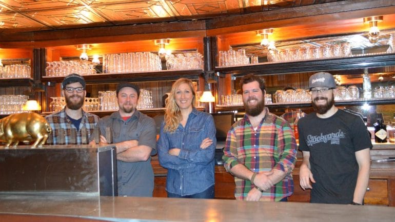 Brendan Gargano, Micah Weichart, Melissa VanGoethem, Greg Bland, and Ray Kerzner behind the bar at Stockyards Brewing Company. (Photo: Jonathan Bender | Flatland)