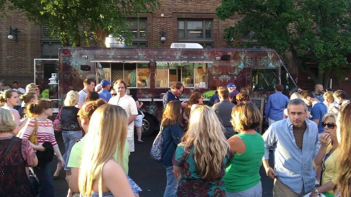 A food truck and a hungry crowd.