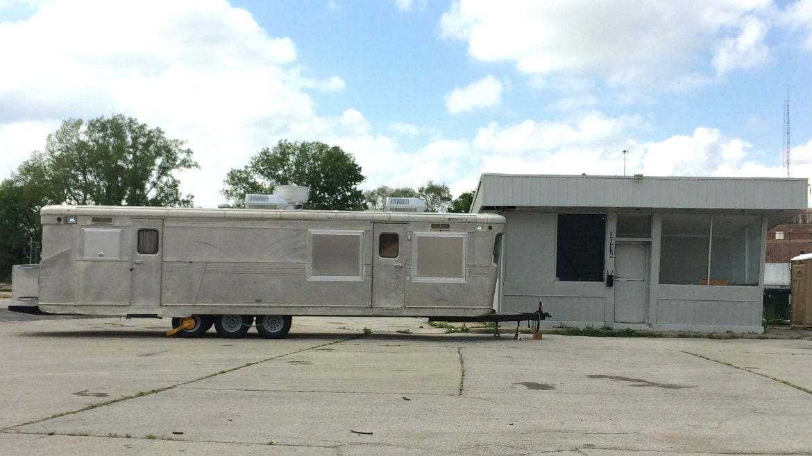 A food truck parked in a parking lot.