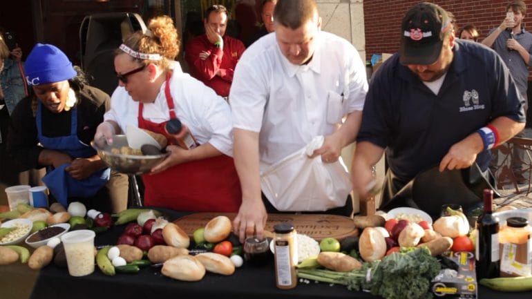 Competitors in a cooking contest gather food