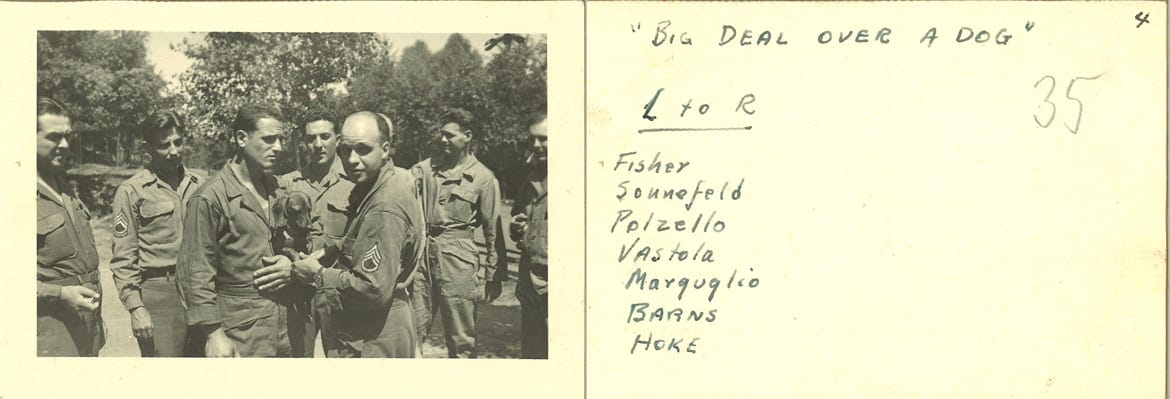 Soldiers looking at a dog