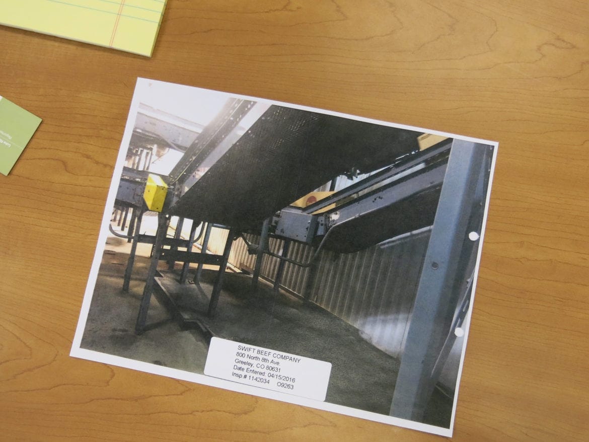 An OSHA photograph shows changes made to the conveyor belt at the JBS beef processing plant in Greeley, Colorado, that killed Ed Horner. It’s now covered in a metal mesh. (Photo: Luke Runyon | Harvest Public Media)