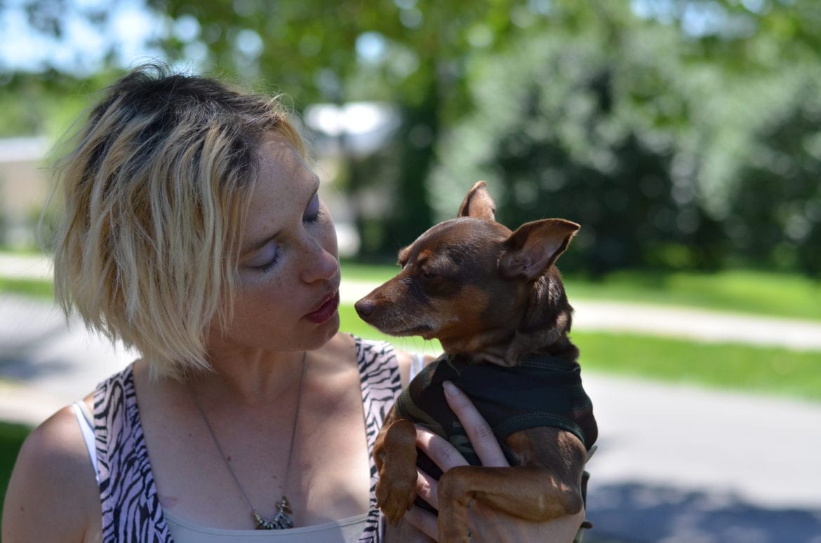 A woman with her dog.