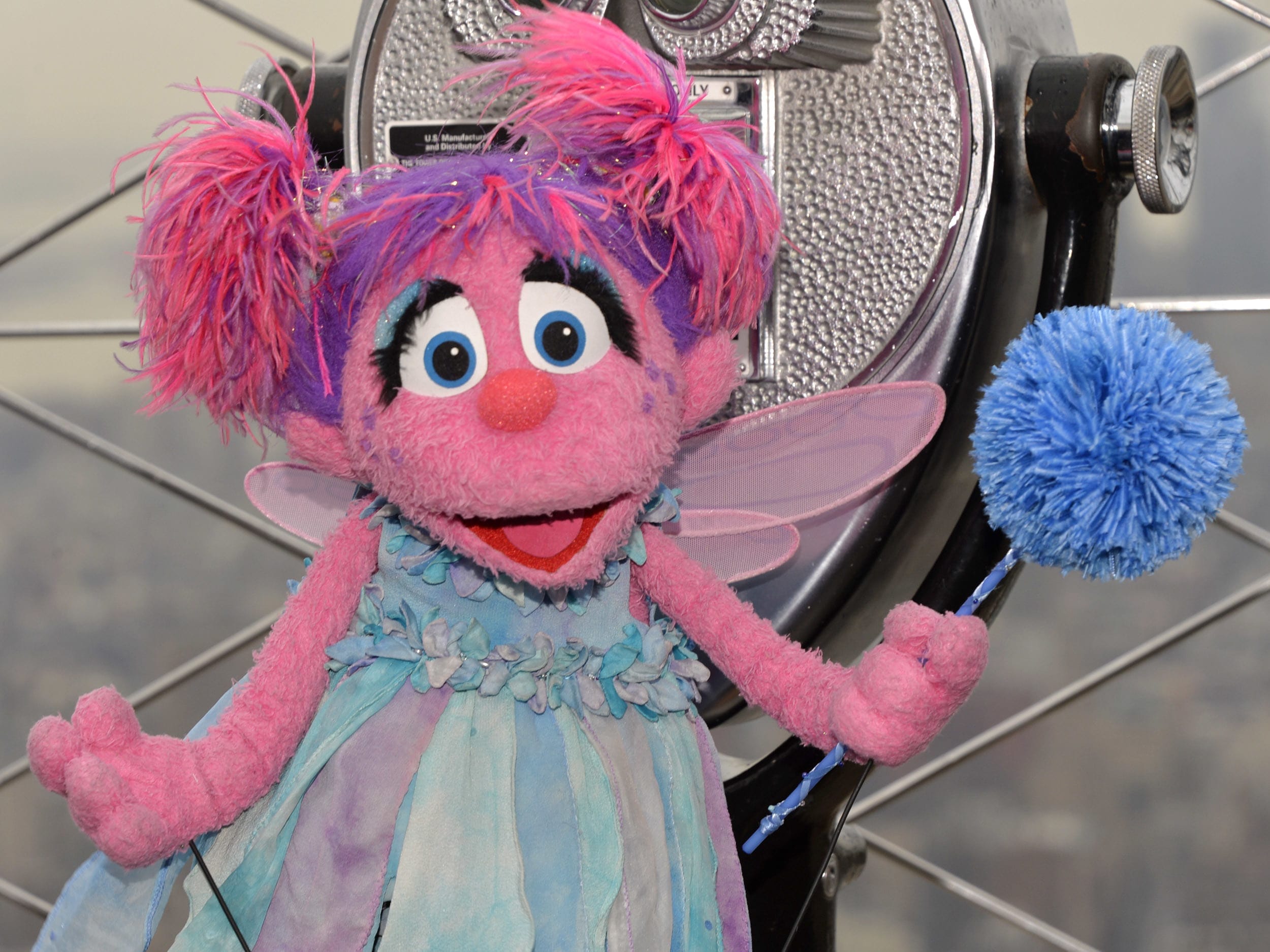 A pink Sesame Street character.