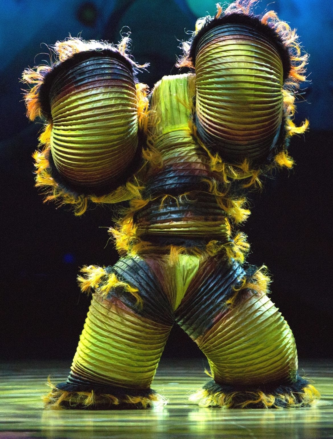 A Cirque du Soleil character on stage.