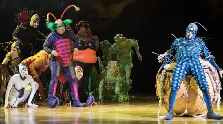 The cast of a Cirque du Soleil show on stage.
