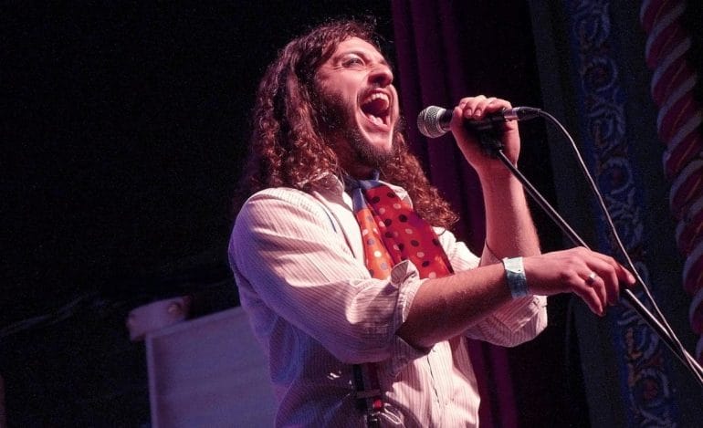 A man singing into a microphone.