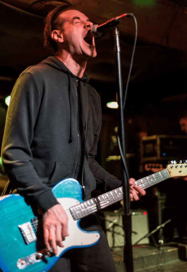 Lead singer of hipshot killers on guitar