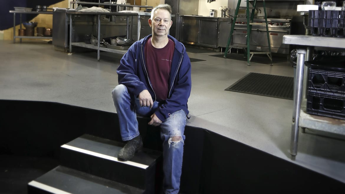 A scenic designer on stage