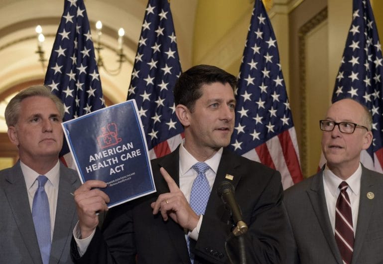 House Speaker Paul Ryan of Wis., center, standing with Energy and Commerce Committee Chairman Greg Walden, R-Ore., right, and House Majority Whip Kevin McCarthy, R-Calif., left, speaks during a news conference on the American Health Care Act on Capitol Hill in Washington, Tuesday, March 7, 2017. (AP Photo/Susan Walsh)