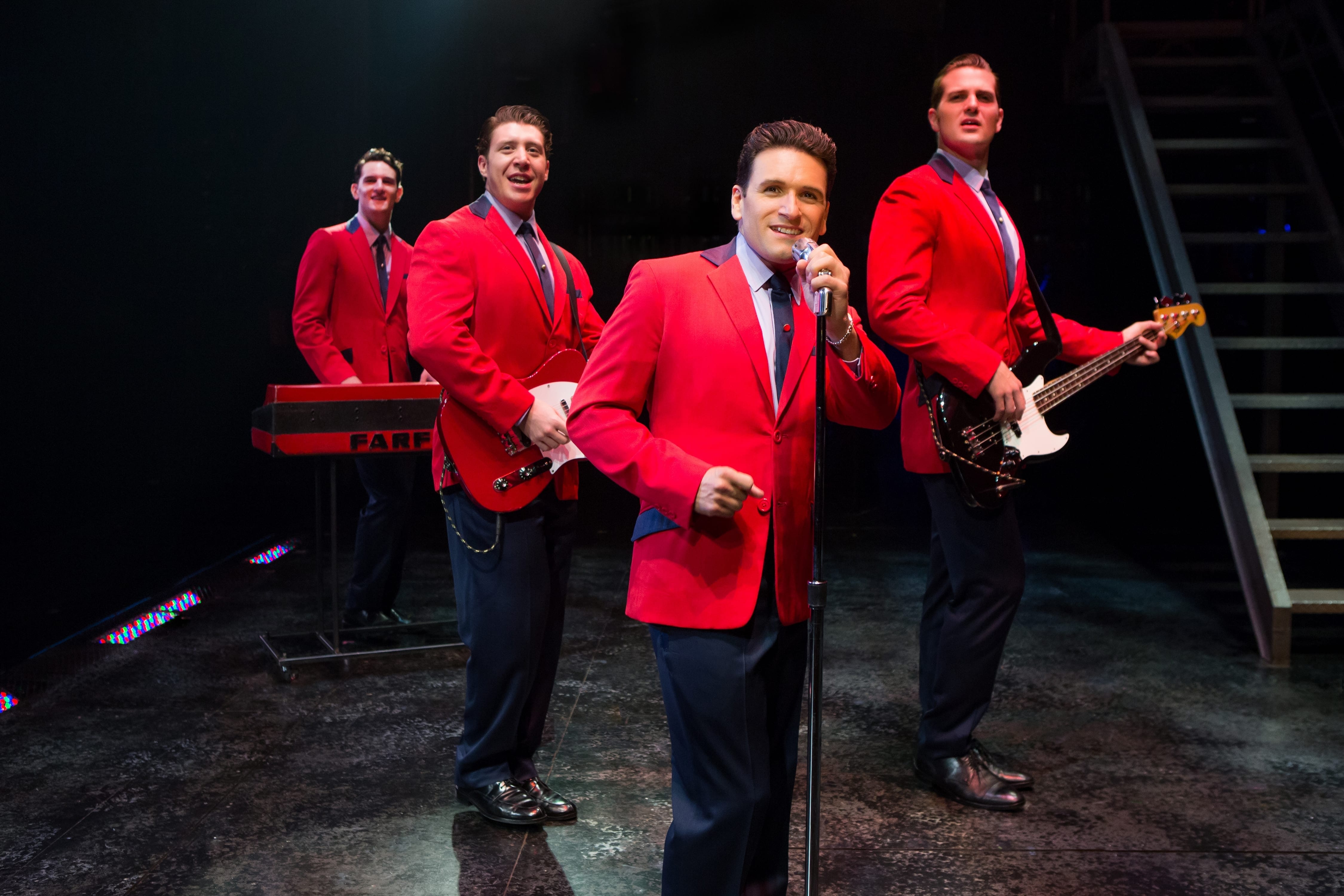 A quartet in red jackets.