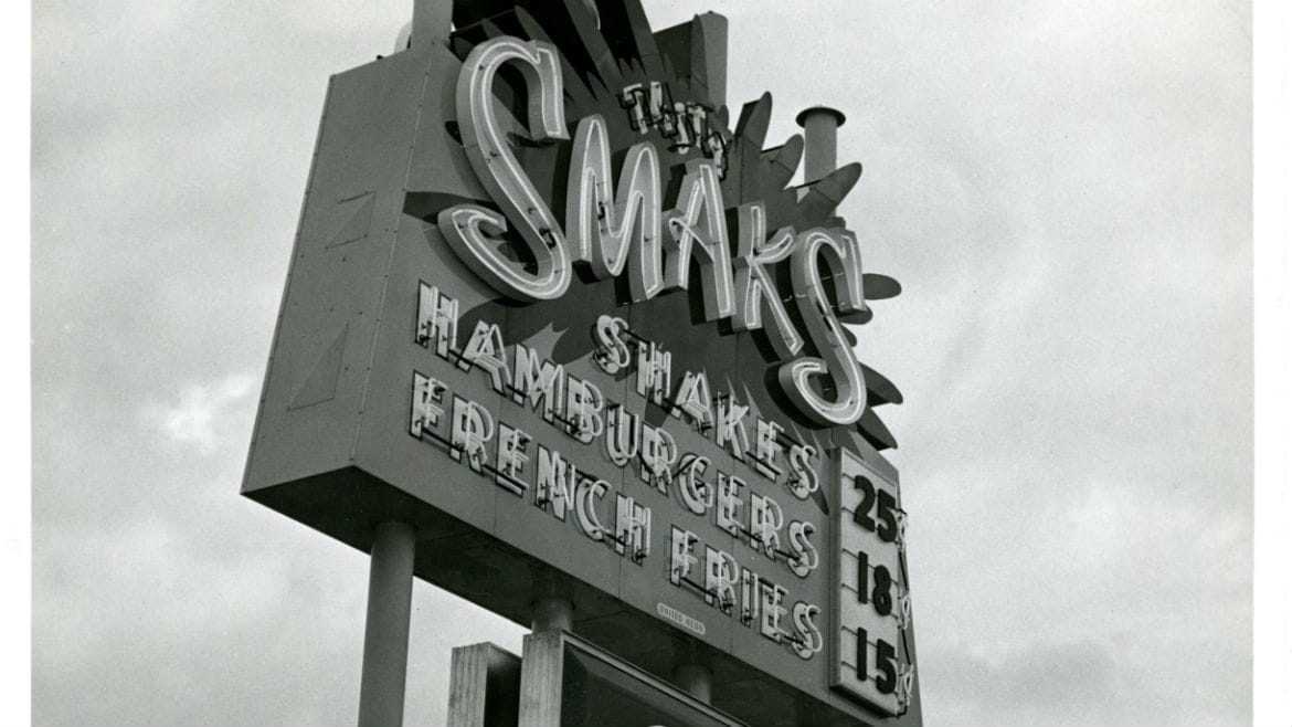 A neon sign for Smak's