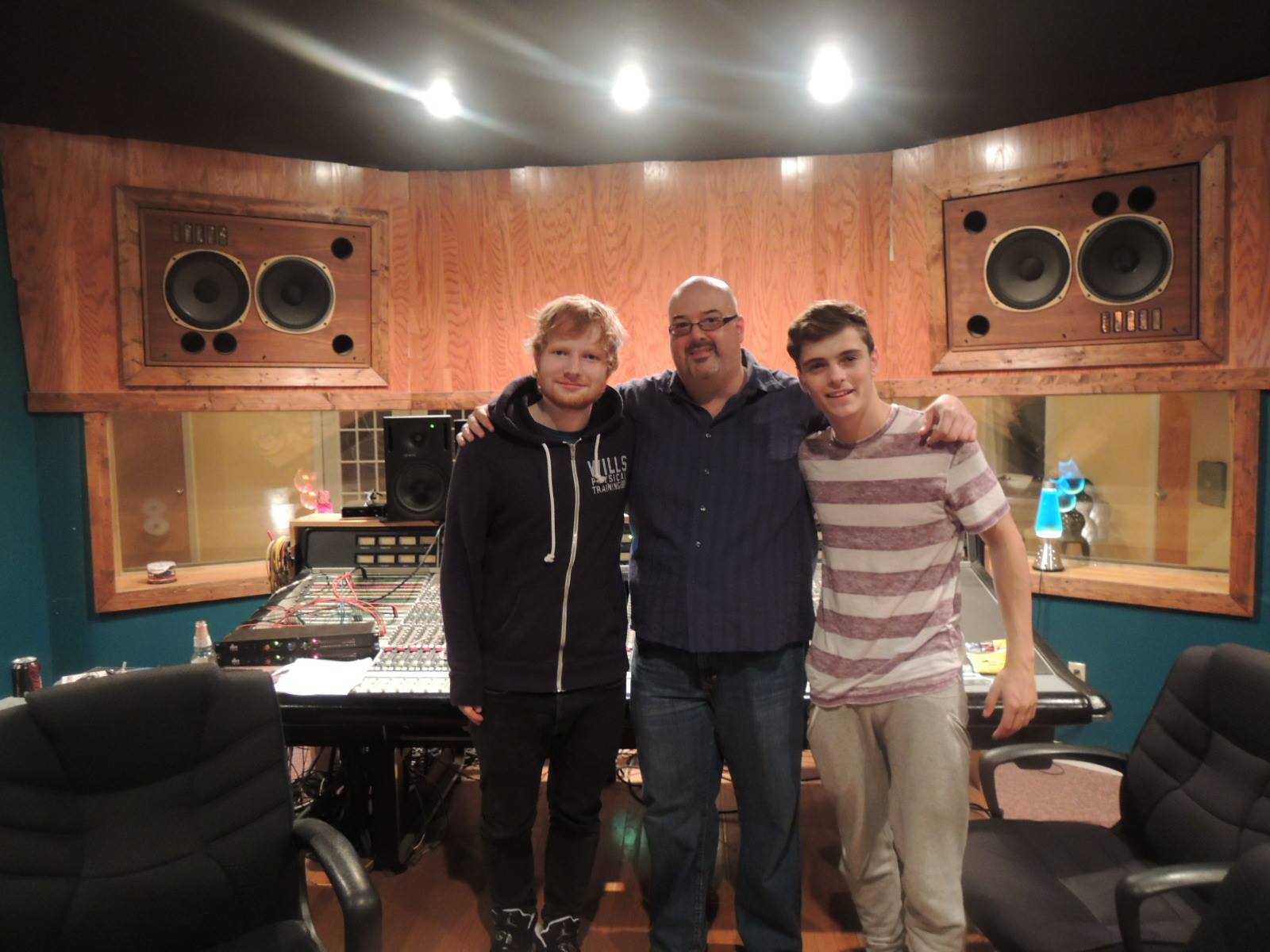 Three men in a recording studio