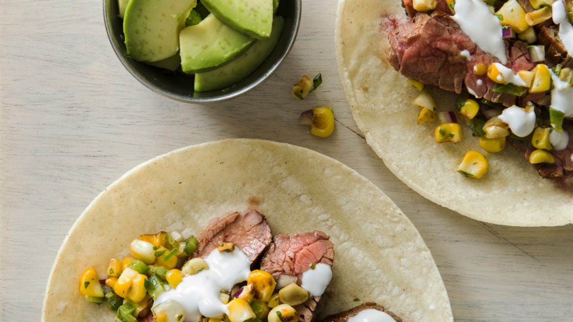 Flank steak tacos with charred corn salsa.