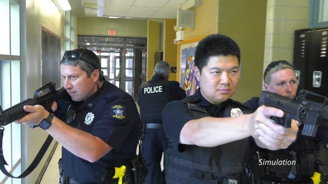 police in active shooter drill in a school