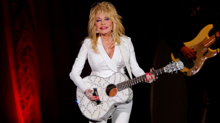 In this July 31, 2015 file photo, Dolly Parton performs in concert at the Ryman Auditorium in Nashville, Tenn. (Photo by Wade Payne/Invision/AP, File)