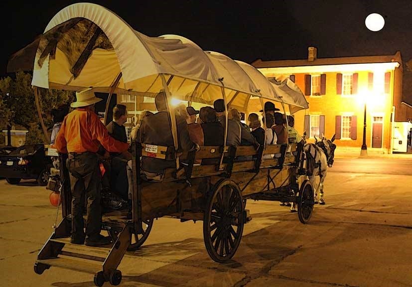 Guests for 1859 Jail Ghost Tours cap their evening with a ride in a mule-drawn wagon.