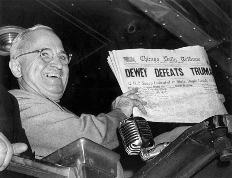 Harry Truman celebrating his upset election victory over Thomas Dewey.