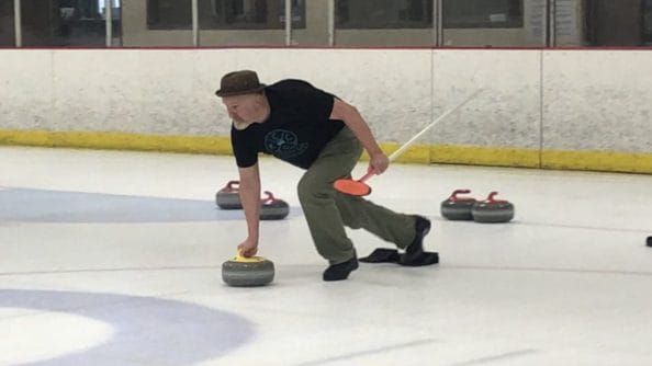 A curler delivers the stone.