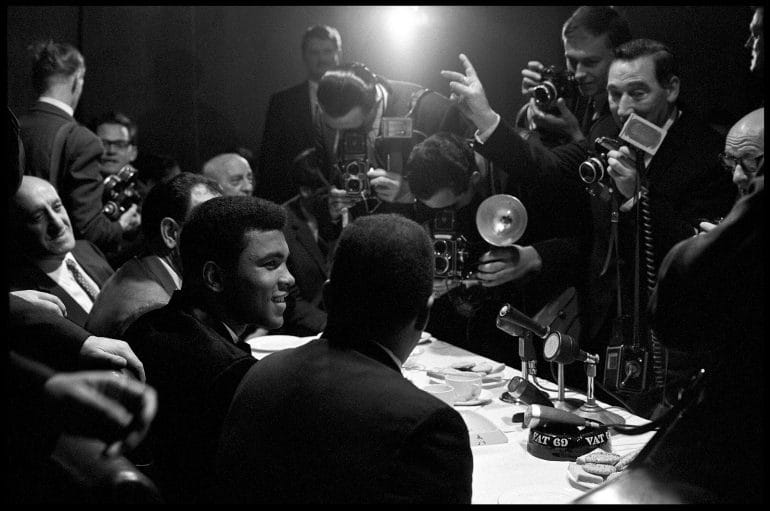 Muhammad Ali interviewed by reporters in London, England,