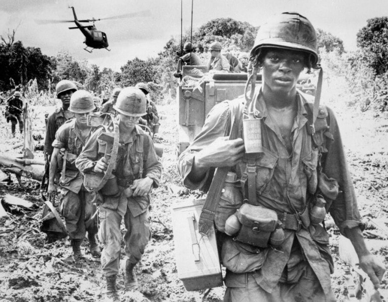Soldiers heading out on a search and destroy mission during the Vietnam War.