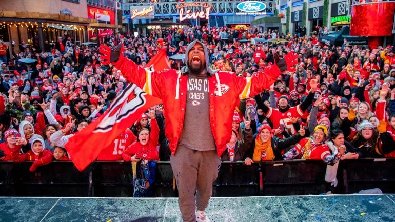 Kansas City rapper Tech N9ne poses on stage at the KC Live! Chiefs watch party