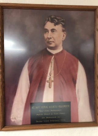 A photo of club founder Msgr. Krmpotic hangs in the club.