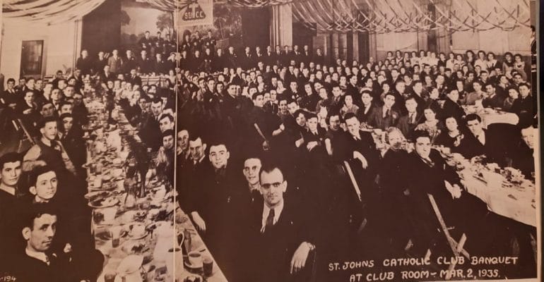 Club members sit at long tables in 1935.