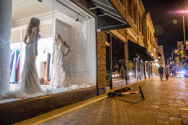 A Country Club Plaza storefront was smashed during protests following the death of George Floyd. 