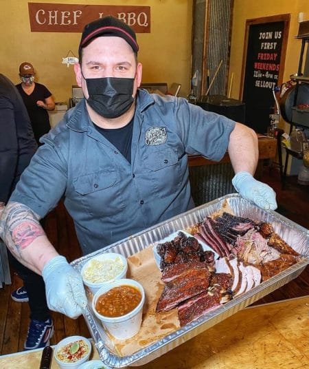 Justin Easterwood of Chef J BBQ serves up a family style platter to-go.
