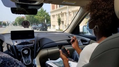 Brenette Wilder (right) navigates her husband, Cleotis, as he drives a route Aug. 6 collecting data for a heat-mapping project coordinated through the University of Missouri-Kansas City.