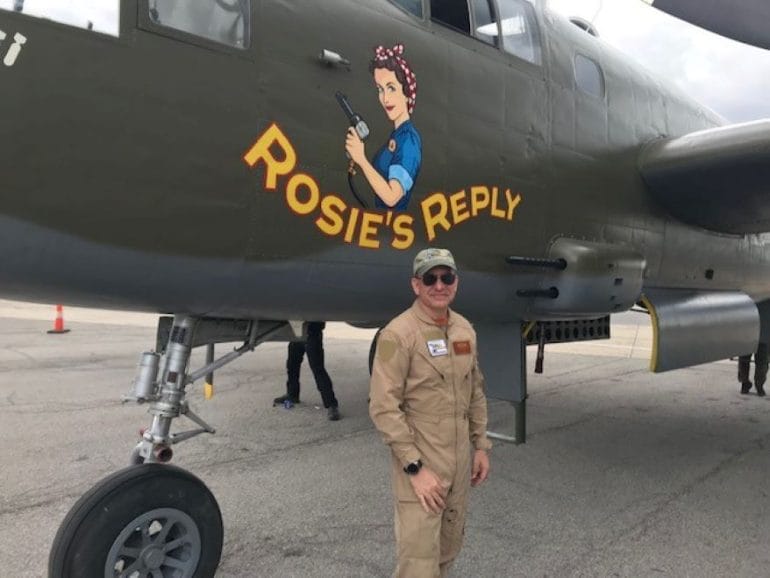 Dan Desko standing in front of "Rosie's Reply," a B-25 bomber built in 1943 in the Fairfax Industrial District.