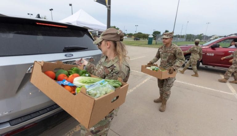 This past summer, four Wichita agencies teamed up with Partnership for a Healthier America to distribute fresh produce through the national Good Food For All program. Volunteers from McConnell Air Force Base, including Tech. Sgt. Jennifer Jordan, left, and Senior Airman Michael Dacayo, center, helped with the distribution.