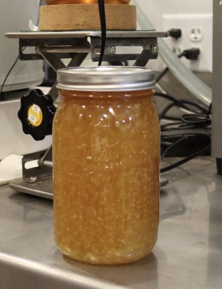 Once extracted and refined, CBD will crystalize, similarly to honey. Here a freshly extracted jar of CBD sits at Rural Route Hemp Co. in Adrian, Missouri.