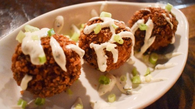 Loaded mashed potato balls with bacon, cheddar, green onions and ranch.