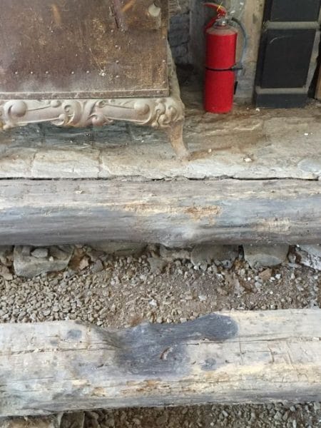 During a recent restoration of the James James Birthplace cabin, workers uncovered a foundation log with a scorch mark.