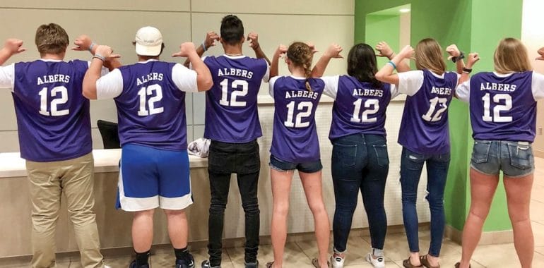 Some of John Albers’ classmates at Blue Valley Northwest High School memorialized his loss by donning school soccer jerseys with John’s name and number.