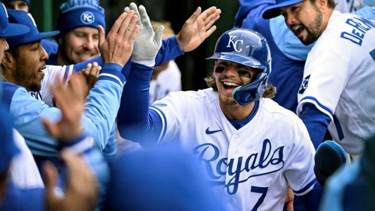Kansas City Royals' Bobby Witt Jr. (7) is congratulated after scoring a run against the Cleveland Guardians during the eighth inning of a baseball game, Thursday, April 7, 2022 in Kansas City, Missouri.