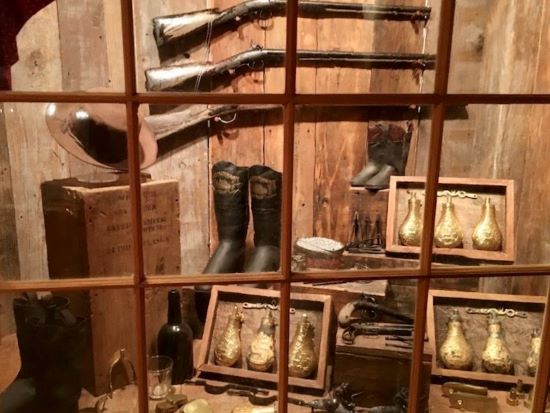 A museum display featuring artifacts salvaged from the Steamboat Arabia.